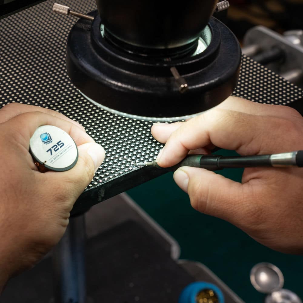 technician examines pixels during led screen repairs.